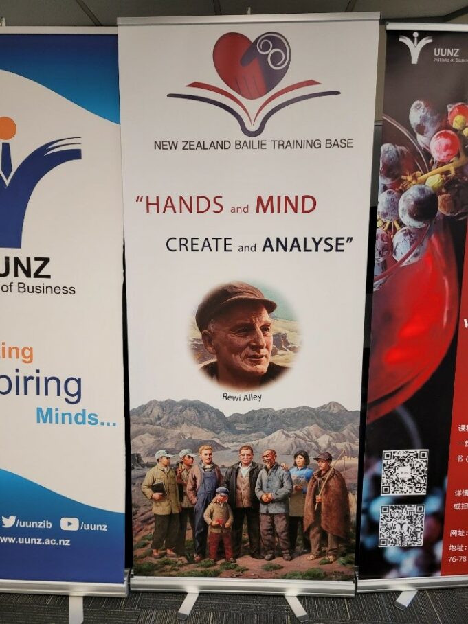 Banner from the New Zealand Bailie Training Base saying “Hands and mind create and analyse”